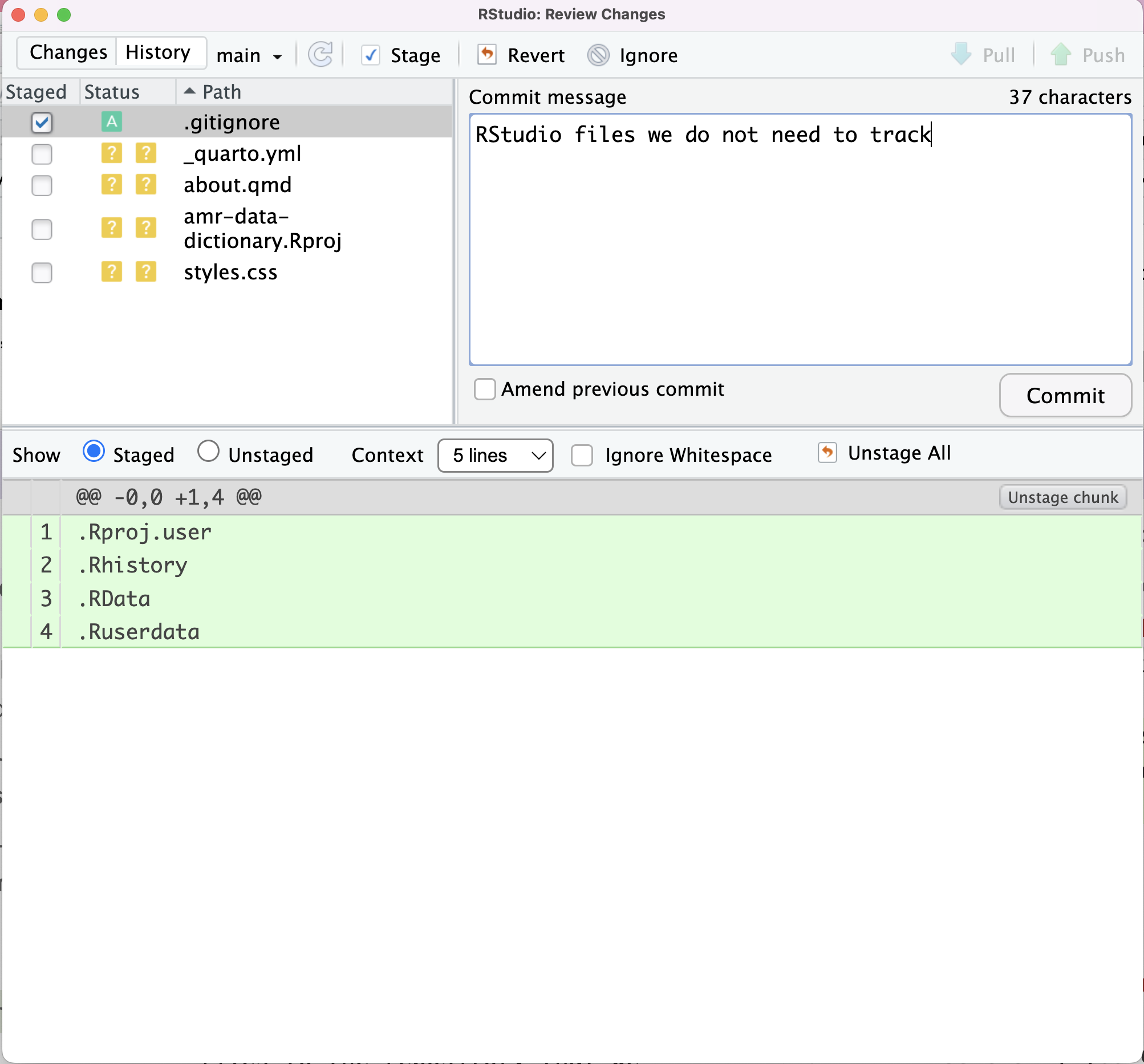 RStudio screenshot showing .gitignore commit text